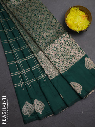 Semi soft silk saree bottle green with allover zari woven checked pattern and zari woven butta border