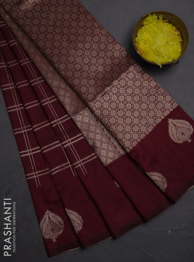 Semi soft silk saree maroon with allover zari woven checked pattern and zari woven butta border