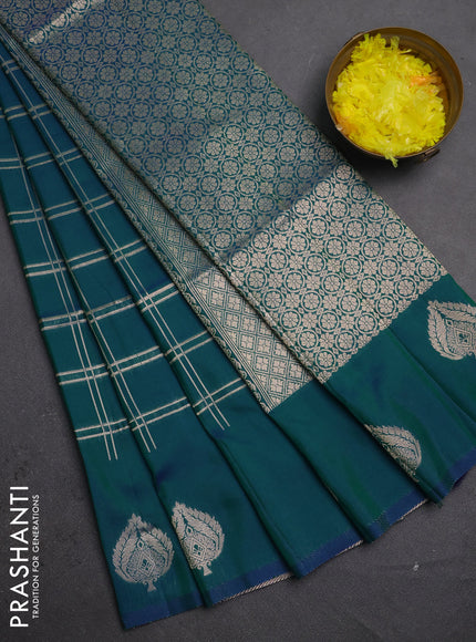 Semi soft silk saree peacock green with allover zari woven checked pattern and zari woven butta border