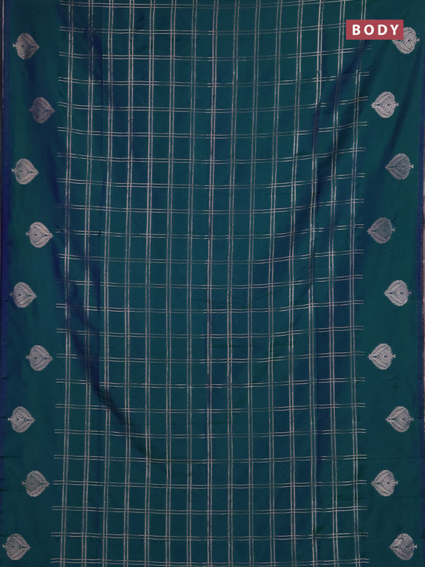 Semi soft silk saree peacock green with allover zari woven checked pattern and zari woven butta border