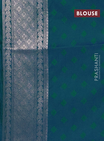 Semi soft silk saree peacock green with allover zari woven checked pattern and zari woven butta border