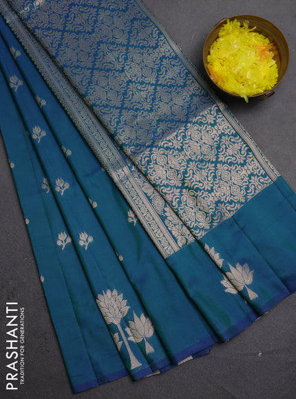 Semi soft silk saree peacock green with allover zari woven buttas and zari woven butta border