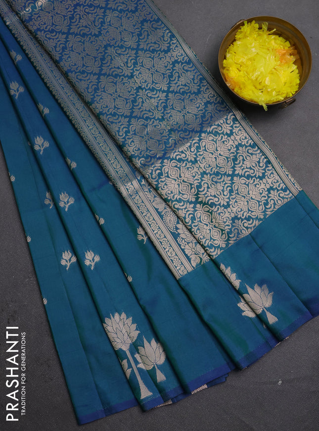 Semi soft silk saree peacock green with allover zari woven buttas and zari woven butta border