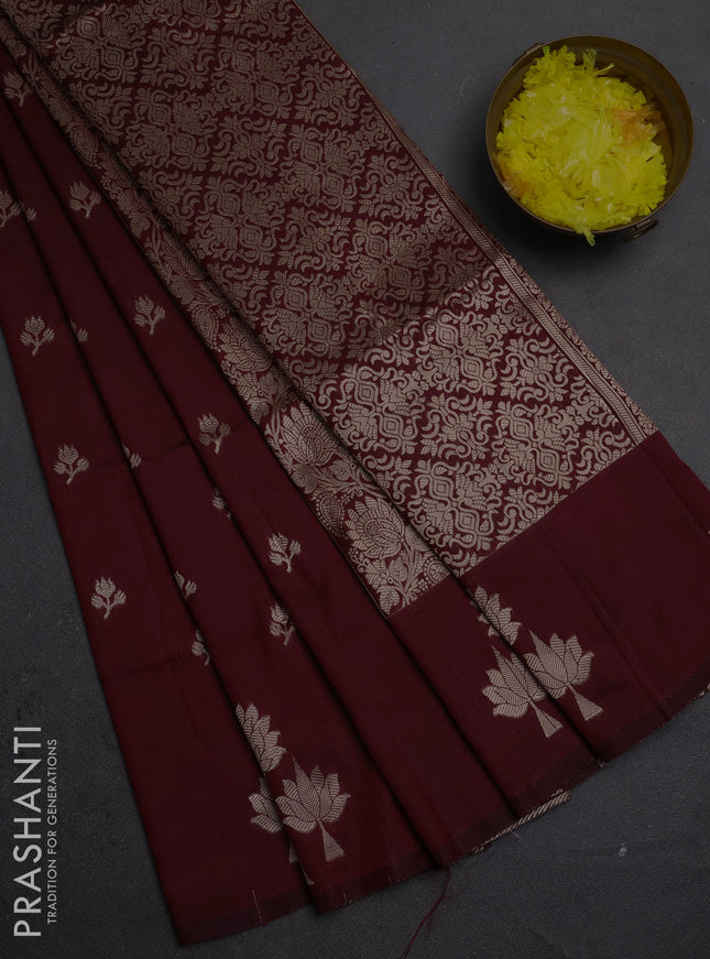 Semi soft silk saree maroon with allover zari woven buttas and zari woven butta border