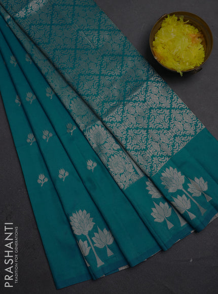 Semi soft silk saree teal blue with allover zari woven buttas and zari woven butta border