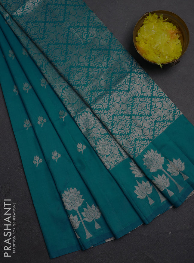 Semi soft silk saree teal blue with allover zari woven buttas and zari woven butta border