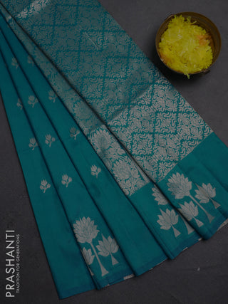 Semi soft silk saree teal blue with allover zari woven buttas and zari woven butta border