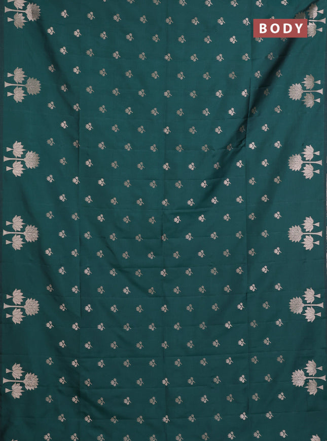 Semi soft silk saree bottle green with allover zari woven buttas and zari woven butta border
