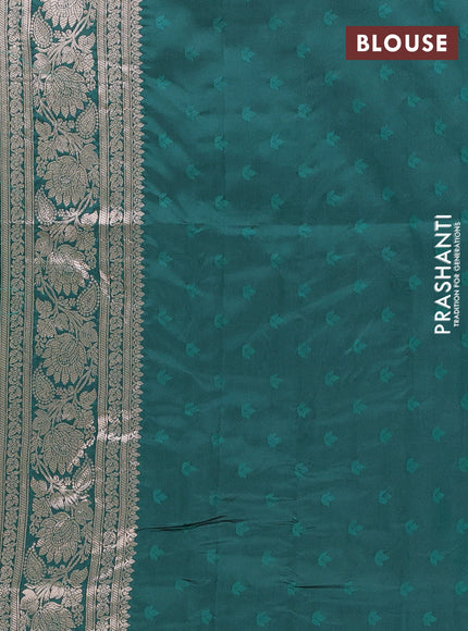 Semi soft silk saree bottle green with allover zari woven buttas and zari woven butta border