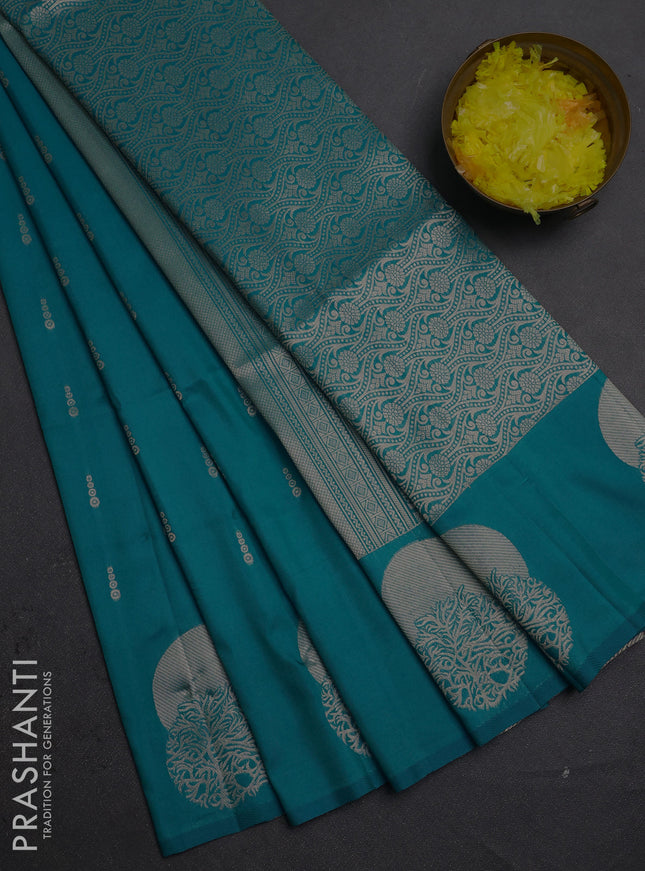Semi soft silk saree teal blue with allover zari woven buttas and zari woven butta border