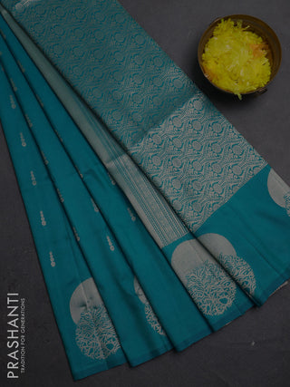 Semi soft silk saree teal blue with allover zari woven buttas and zari woven butta border