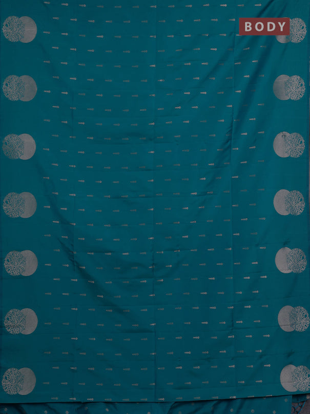 Semi soft silk saree teal blue with allover zari woven buttas and zari woven butta border