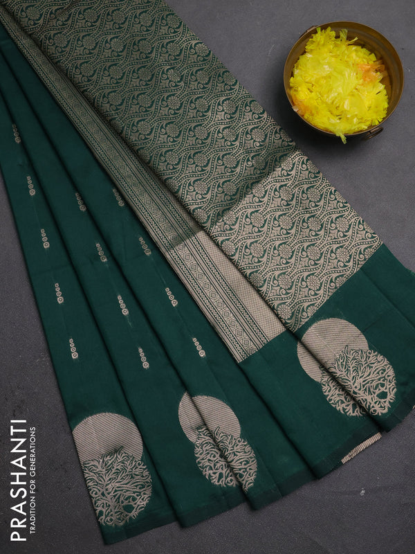 Semi soft silk saree bottle green with allover zari woven buttas and zari woven butta border