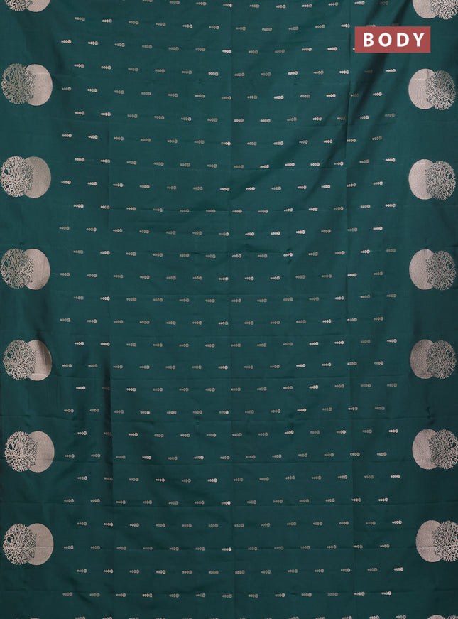 Semi soft silk saree bottle green with allover zari woven buttas and zari woven butta border