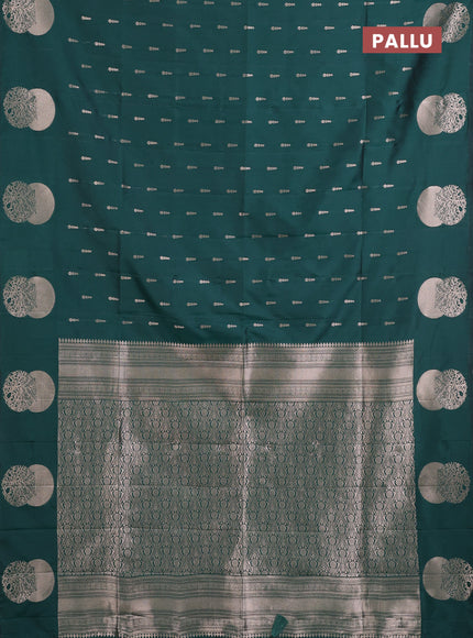 Semi soft silk saree bottle green with allover zari woven buttas and zari woven butta border