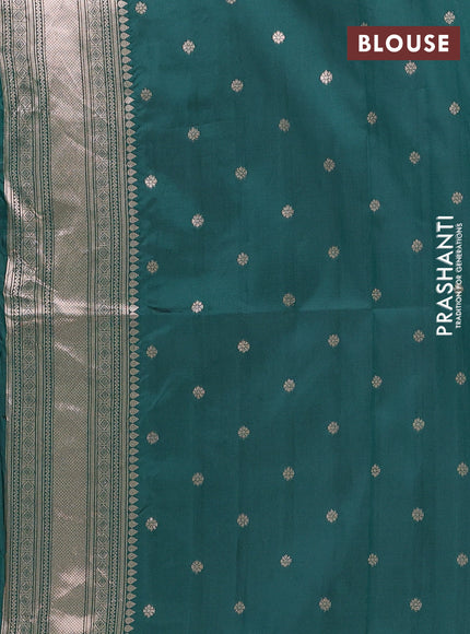 Semi soft silk saree bottle green with allover zari woven buttas and zari woven butta border