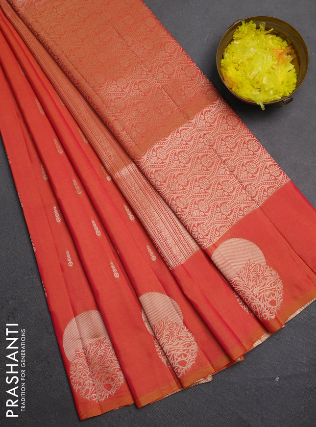 Semi soft silk saree sunset orange with allover zari woven buttas and zari woven butta border