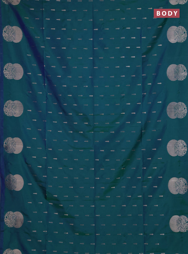 Semi soft silk saree peacock green with allover zari woven buttas and zari woven butta border
