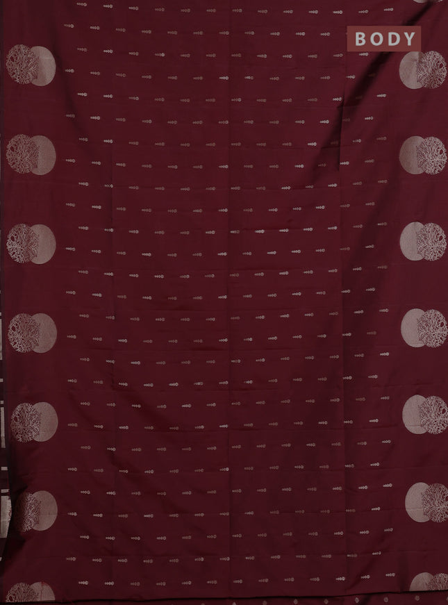 Semi soft silk saree maroon with allover zari woven buttas and zari woven butta border