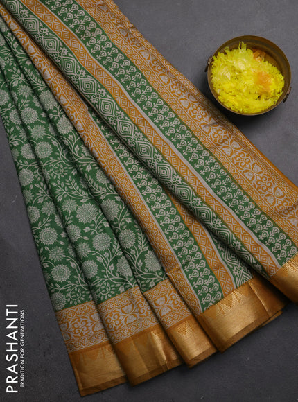 Semi maheshwari cotton saree light green and mustard yellow with allover floral prints and zari woven border