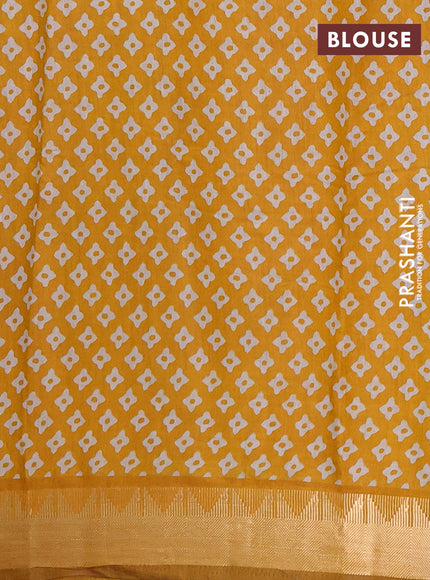 Semi maheshwari cotton saree light green and mustard yellow with allover floral prints and zari woven border