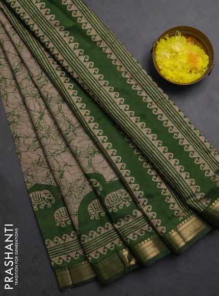 Semi maheshwari cotton saree beige and green with allover batik prints and zari woven border