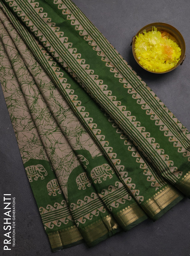 Semi maheshwari cotton saree beige and green with allover batik prints and zari woven border