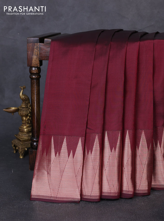 Pure kanchipuram silk saree wine shade with plain body and temple design zari woven border