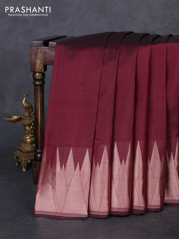 Pure kanchipuram silk saree wine shade with plain body and temple design zari woven border