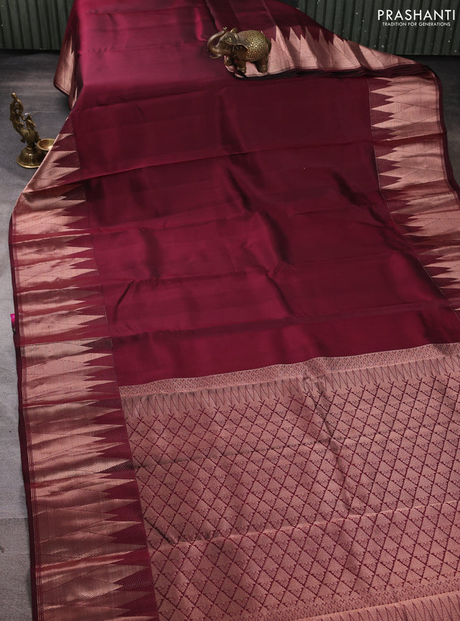 Pure kanchipuram silk saree wine shade with plain body and temple design zari woven border