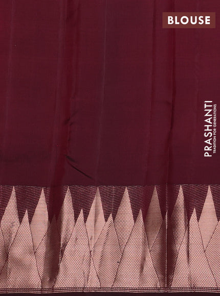 Pure kanchipuram silk saree wine shade with plain body and temple design zari woven border