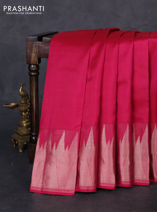 Pure kanchipuram silk saree dark pink with plain body and temple design zari woven border