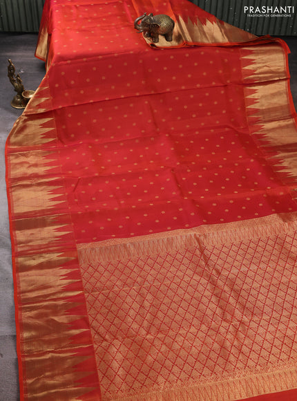 Pure kanchipuram silk saree rustic orange with allover zari woven 1000 buttas and temple design zari woven border