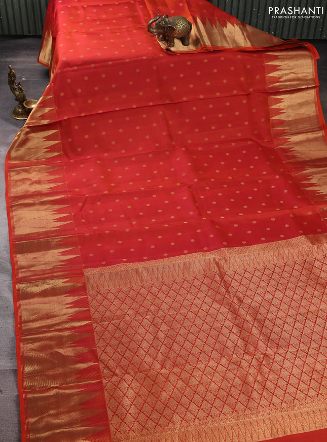 Pure kanchipuram silk saree rustic orange with allover zari woven 1000 buttas and temple design zari woven border