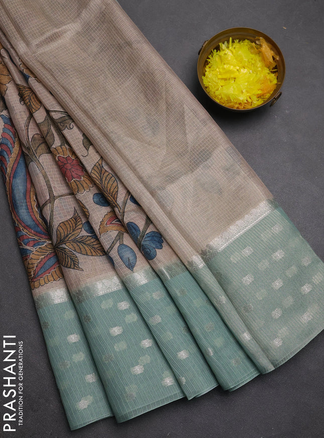 Art kota saree beige and pastel green with allover kalamari prints & embroidery work and zari woven border
