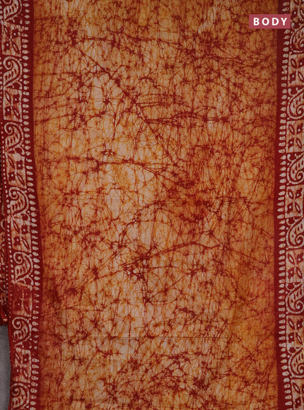 Batik cotton saree mustard yellow and maroon with allover prints and batik printed border