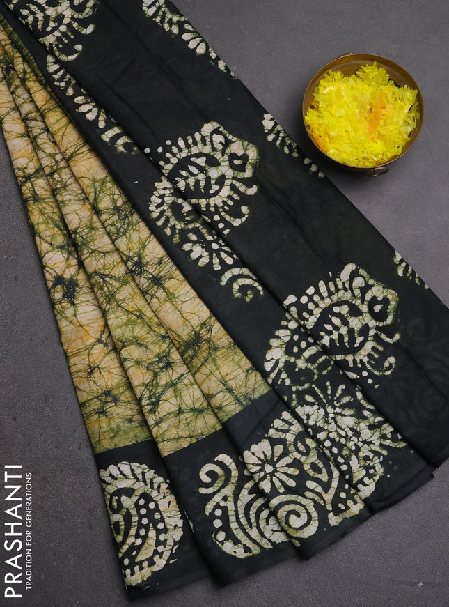 Batik cotton saree peach shade and black with allover prints and batik printed border