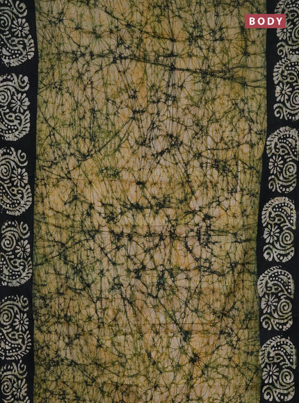 Batik cotton saree peach shade and black with allover prints and batik printed border