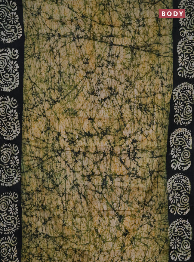 Batik cotton saree peach shade and black with allover prints and batik printed border