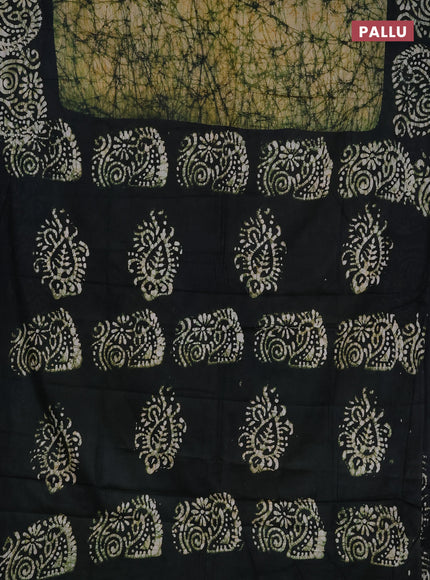 Batik cotton saree peach shade and black with allover prints and batik printed border