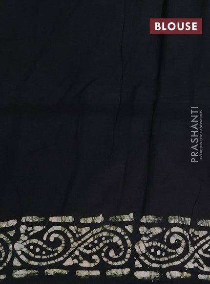 Batik cotton saree peach shade and black with allover prints and batik printed border