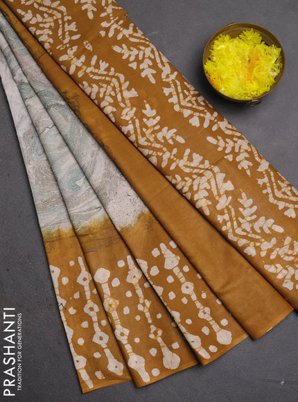 Batik cotton saree multi colour and dark mustard with allover prints and batik printed border
