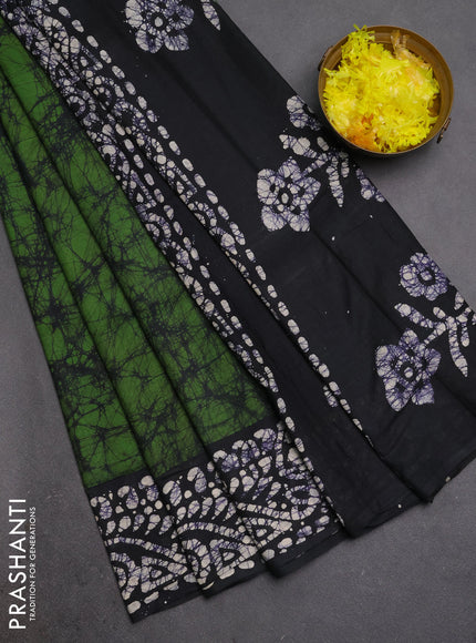 Batik cotton saree green and navy blue with allover prints and batik printed border