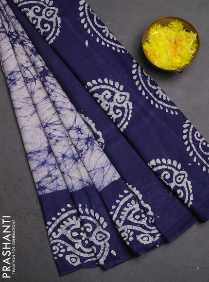 Batik cotton saree off white and navy blue with allover prints and batik printed border