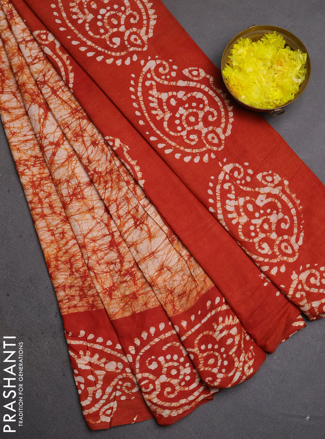 Batik cotton saree rust shade with allover prints and batik printed border