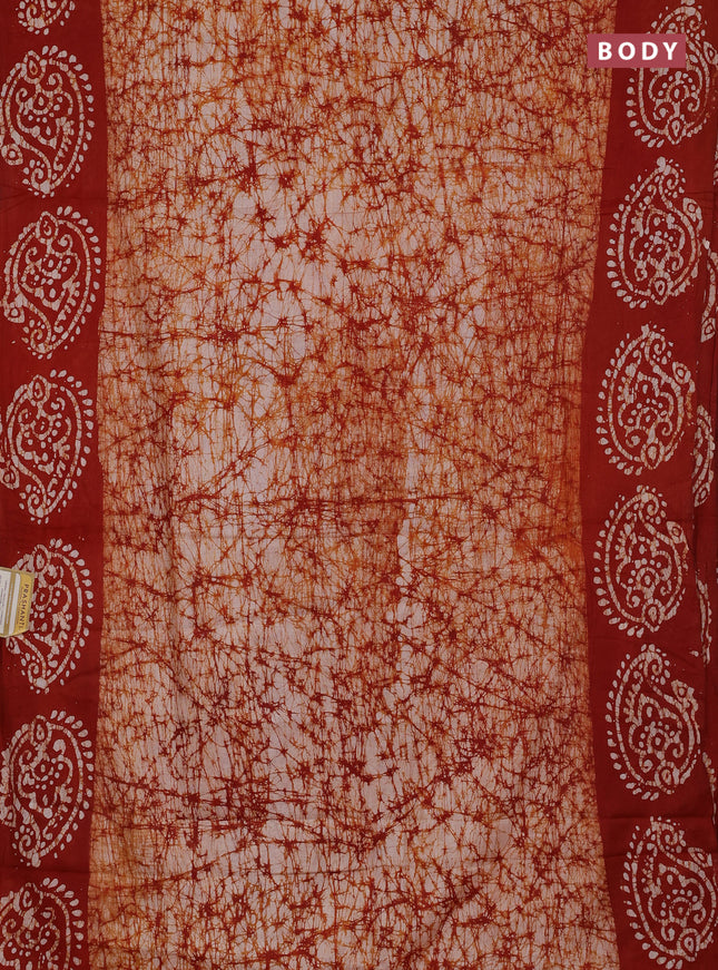 Batik cotton saree rust shade with allover prints and batik printed border