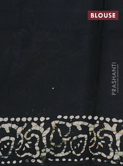 Batik cotton saree bottle green with allover prints and batik printed border