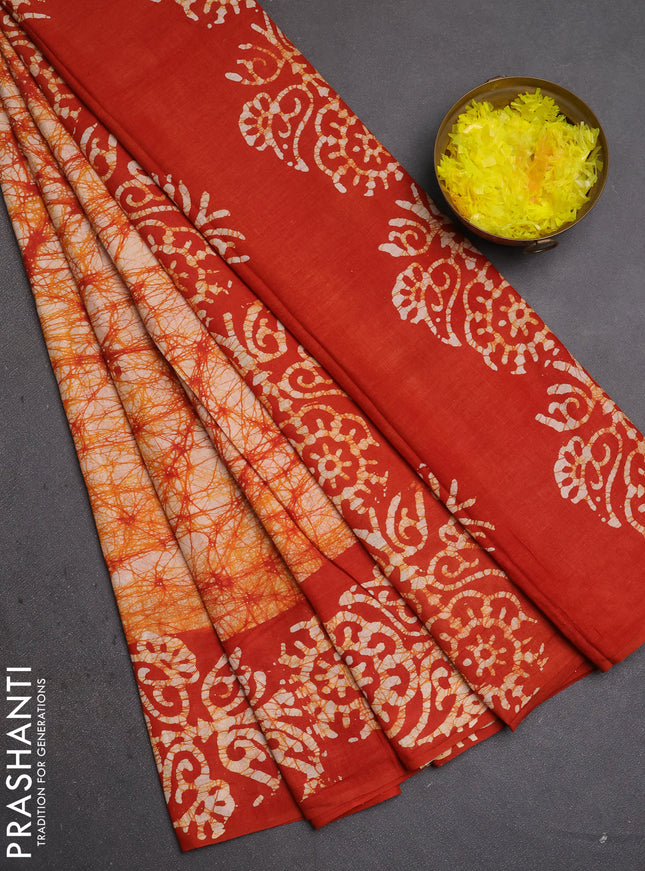 Batik cotton saree orange with allover prints and batik printed border