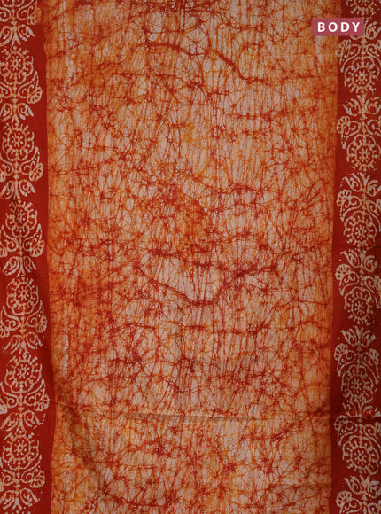 Batik cotton saree orange with allover prints and batik printed border
