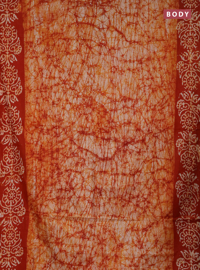 Batik cotton saree orange with allover prints and batik printed border